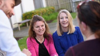 Members of staff on Frenchay Campus smiling together