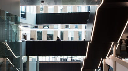 An image of a modern staircase in the Bristol Business School.