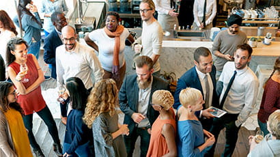 Smartly dressed people networking in a coffee shop