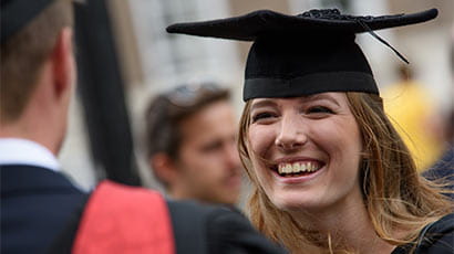 Close up image of a student smiling at graduation