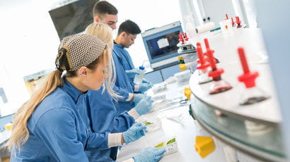 Students in a lab looking at samples