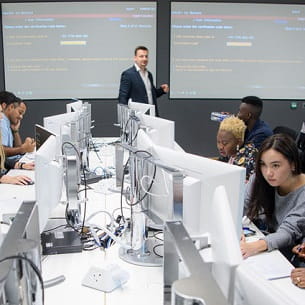 Students and teacher in the Bloomberg Room