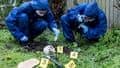 Forensic science students in protective clothing investigating a crime scene
