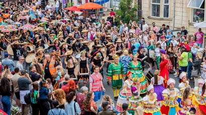 Crowd in street for St Paul's festival.