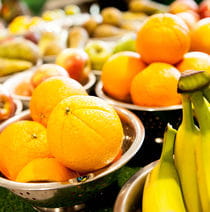 Closeup of bowls of fruit.