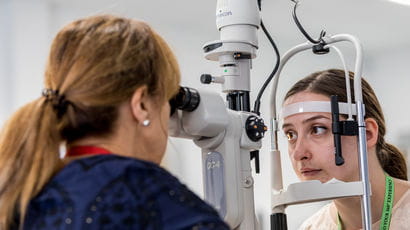 Woman having eye examination.