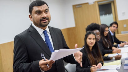 Law student making a case in a mock court room