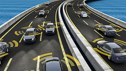 computer-generated image of cars on a motorway. each car is surrounded by a radius, meant to indicate sensors  