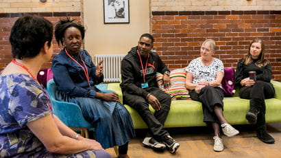 Students sat in a therapy room with patients.