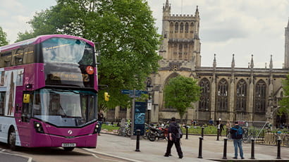 City bus driving past Bristol Cathedral