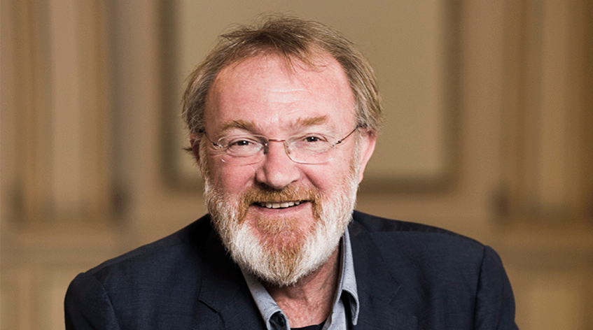 Smiling man with beard and glasses