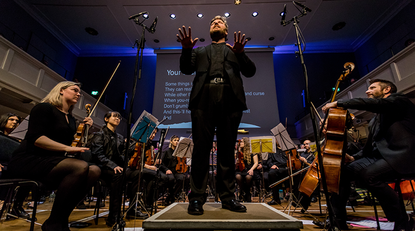 choir conductor and orchestra