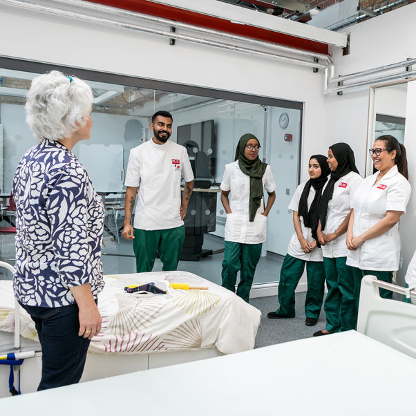 Occupational therapy students listening to their lecturer