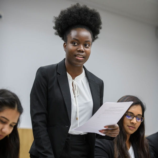 Law student in mock courtroom