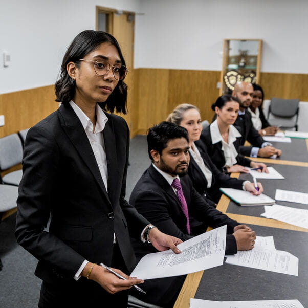 Law students in mock courtroom.