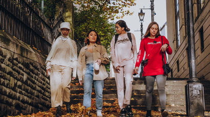 A group of students walking in the city centre.