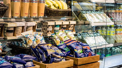 A selection of crisps, drinks and fruit in an on-campus catering outlet.