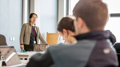 Business programme leader leading a lecture to undergraduate students.