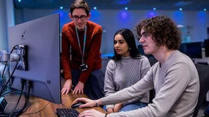 Students looking at a monitor.