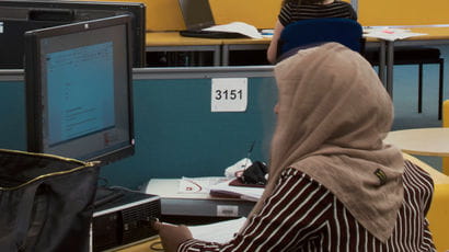 student looking at a computer