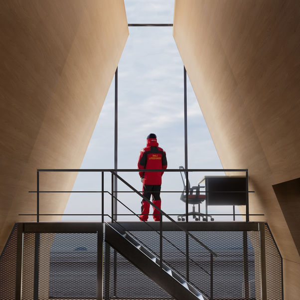 Person standing between two design structures