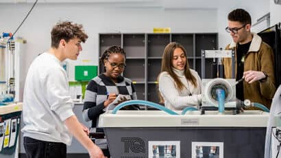 Four students working on an engineering project.