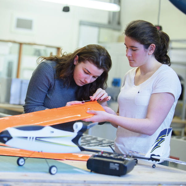 Two students working on aerospace engineering project