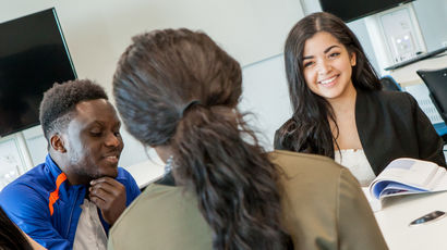 A group of students around a table