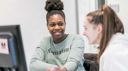 A photo of two UWE Bristol students smiling together