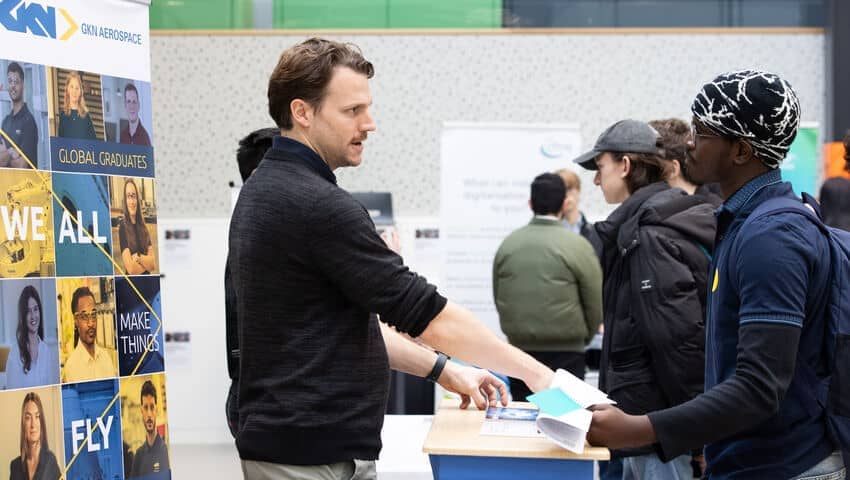 An employer and a student chatting at the engineering careers fair.