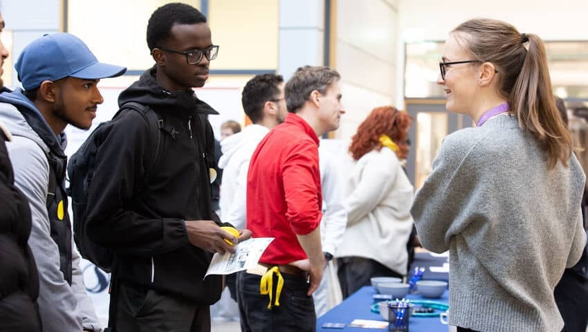 An employer and a student chatting at the engineering careers fair.