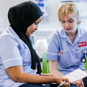 Two student nurses working in Glenside Hospital.