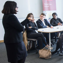 Lecturer talking to a group of Law students.