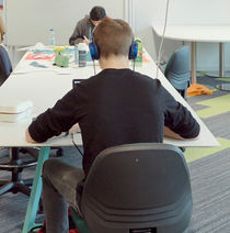 Student working at a table.