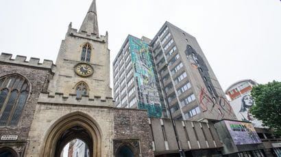 A street in Bristol city centre showing different eras of architecture.