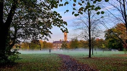 View of Glenside campus building through trees