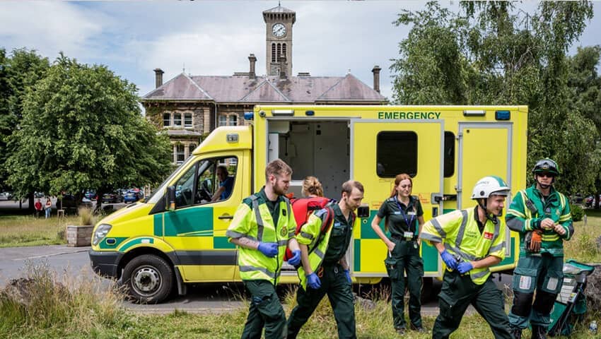 Multi-dicilpinary student air crash simulation in 2022, in front of Glenside clock tower.