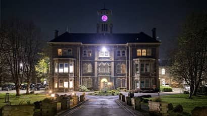 Glenside building lit up at night.