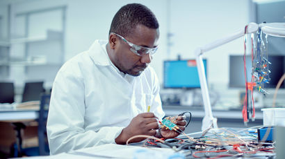 Scientist working on technology.