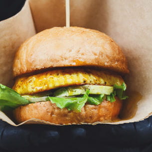 Vegan burger in a paper bag.