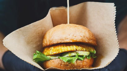 Vegan burger in a paper bag.