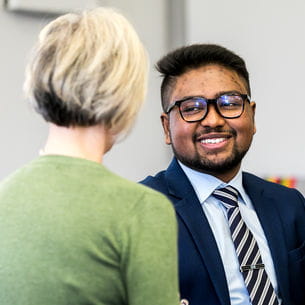 Student talking with a UWE Bristol member of staff.