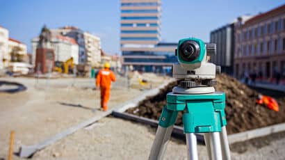 Surveying equipment on a construction site. Image credit: iStock.com/roman023