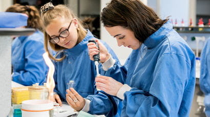 Students in the lab with pipettes