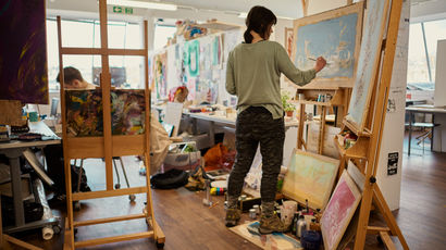 Student painting in the Arnolfini