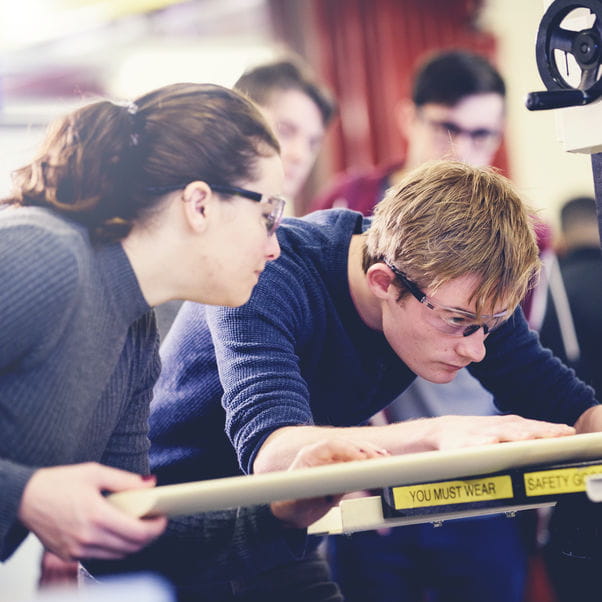 Students using equipment in engineering studio