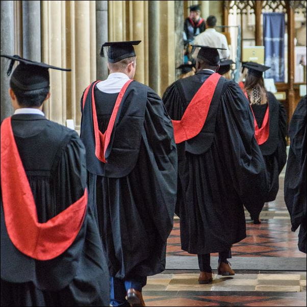 Students at graduation walking into the venue.