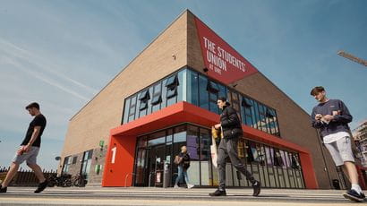 Students walking past The Students' Union at UWE building on Frenchay Campus.