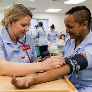 Student midwives on a training ward.