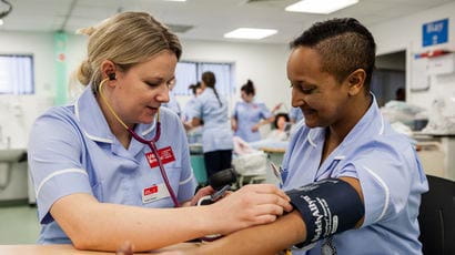 Student midwives on a training ward.